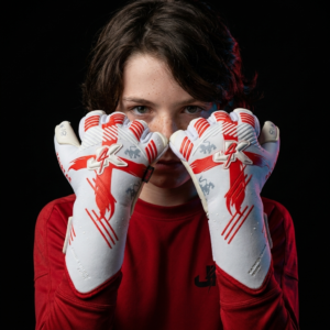 Young goalkeeper wearing J4K goalkeeper gloves